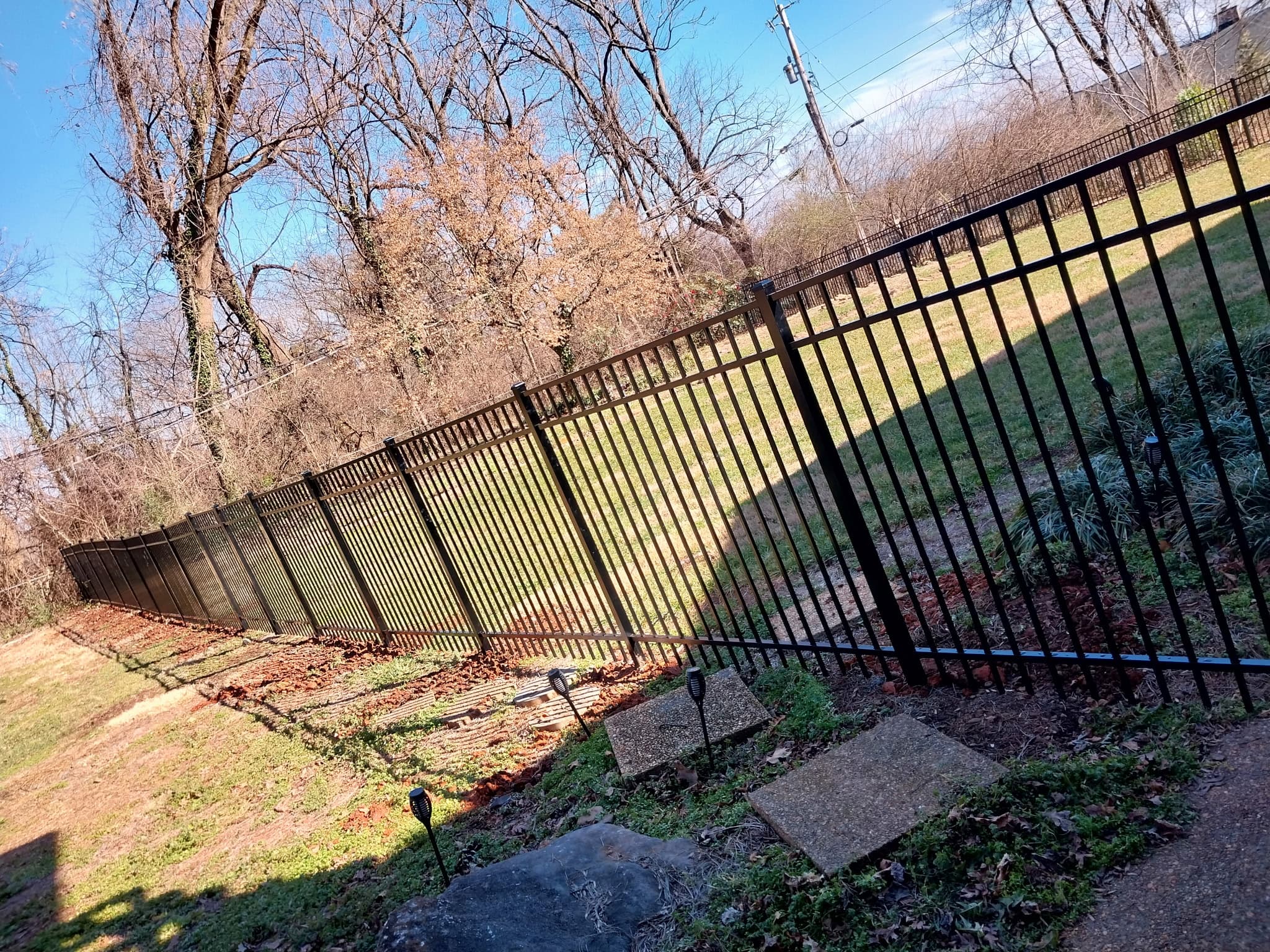Aluminum fence with decorative finials and powder-coated finish