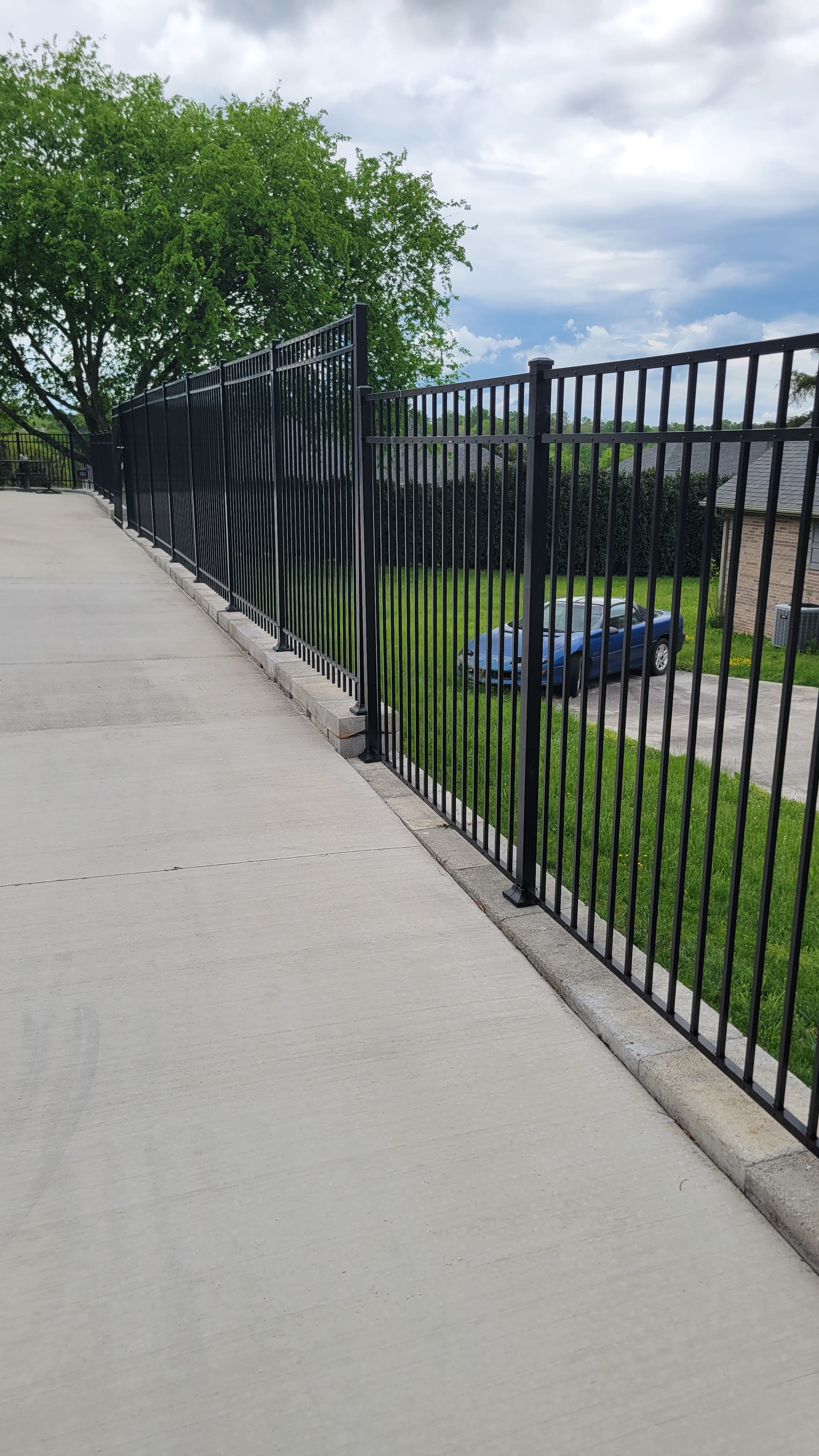 Ornamental aluminum fence with custom cap selections