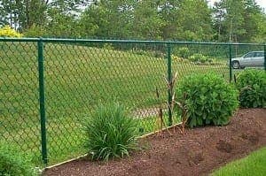 Green vinyl coated chain-link residential fence - Model 504