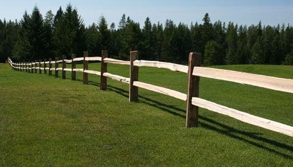 Two split rail wooden fence - traditional rustic style