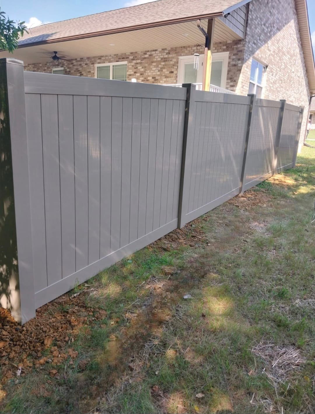 White vinyl privacy fence with gothic pickets