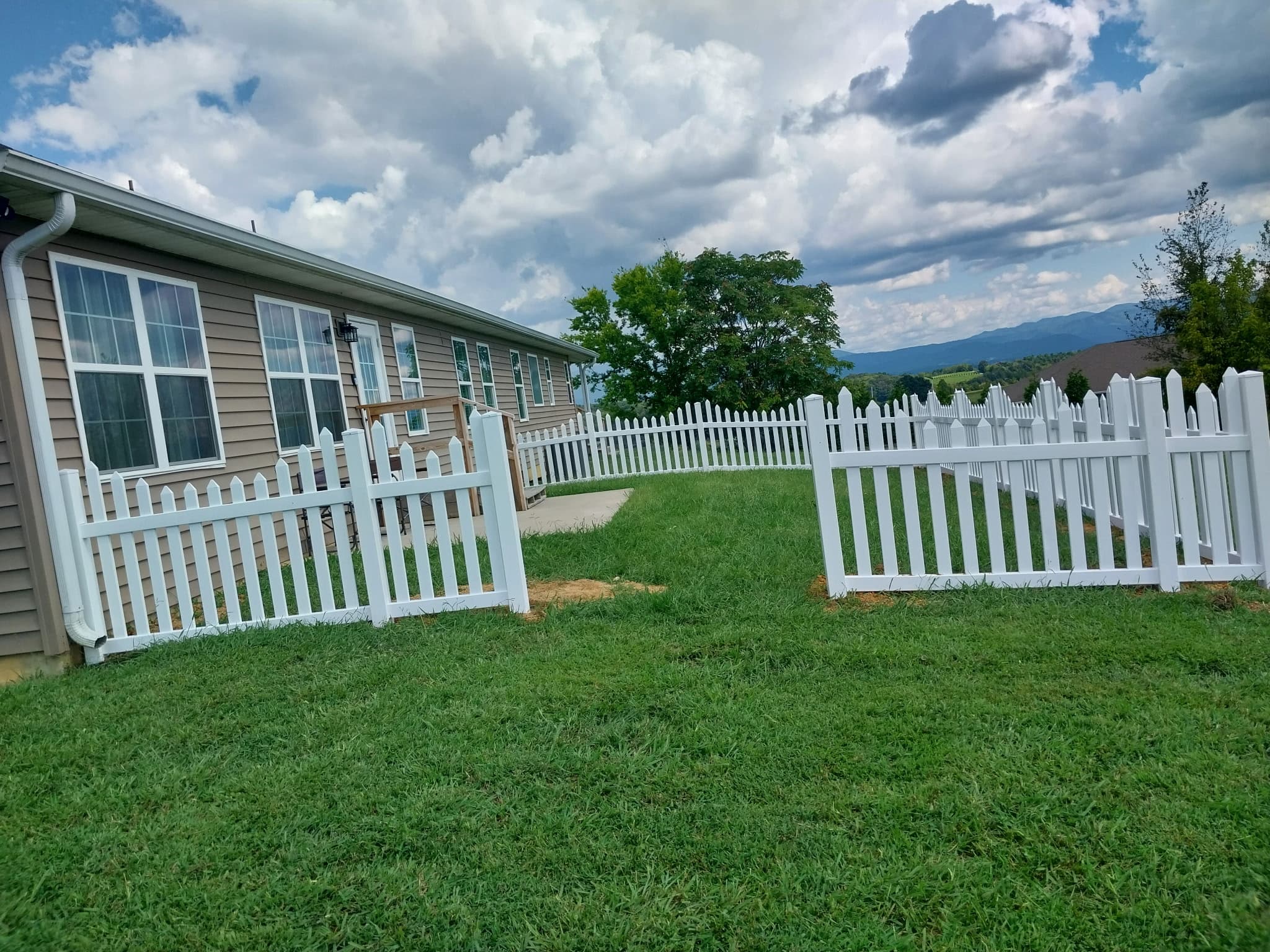Vinyl fence installation in residential backyard