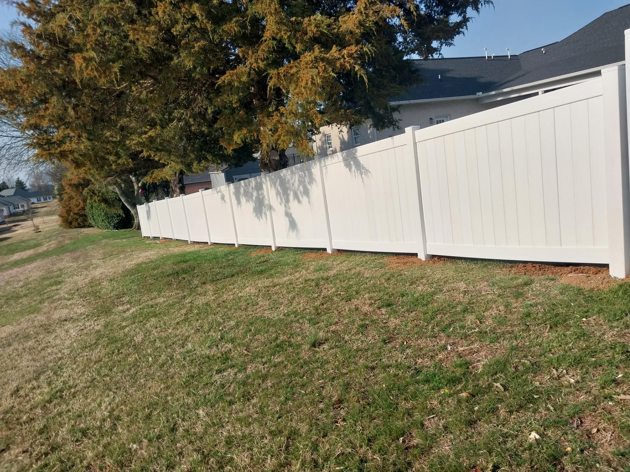 Vinyl spaced picket fence in tan color