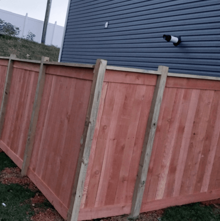 Wood shadowbox fence installation